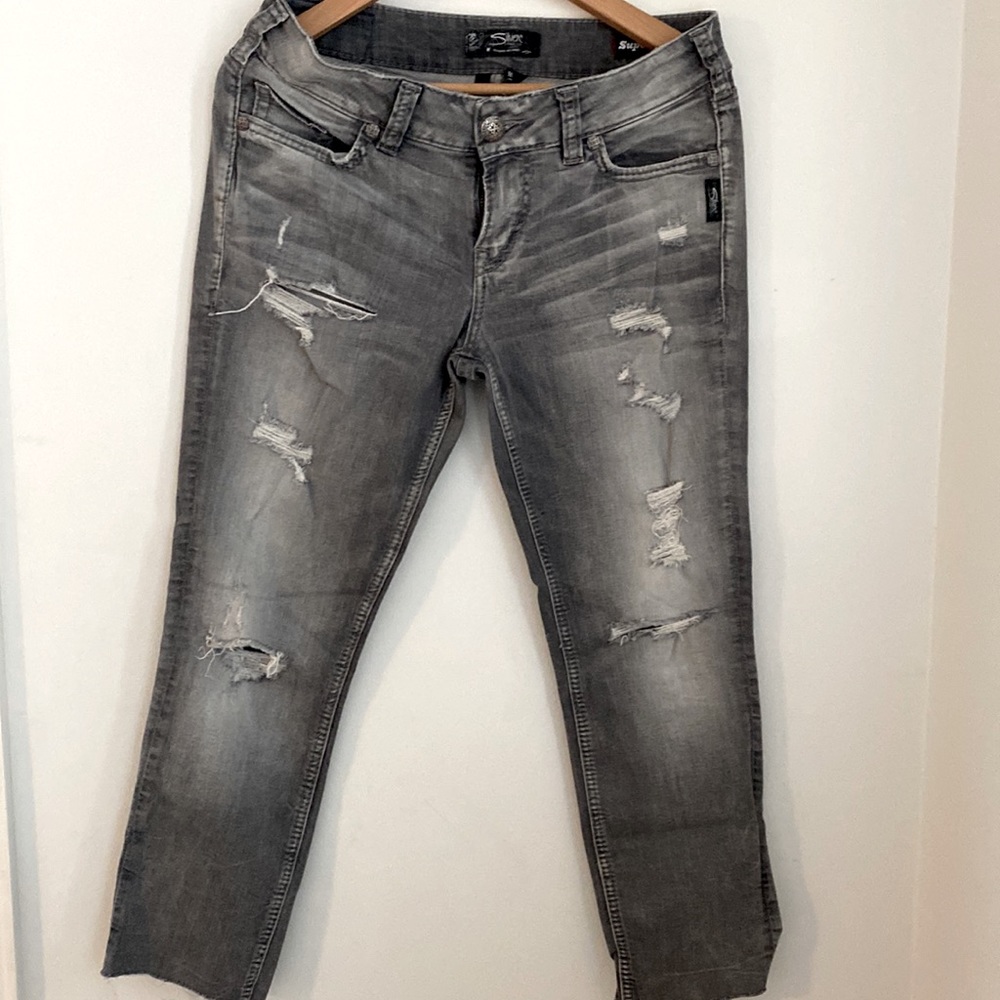 Raw hem grey distressed jeans